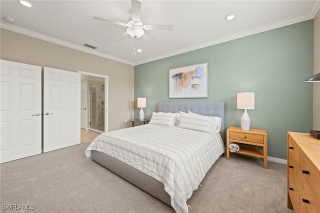 carpeted bedroom with ceiling fan, crown molding, and ensuite bath