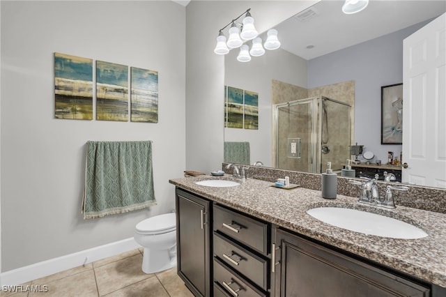 bathroom featuring tile patterned flooring, vanity, walk in shower, and toilet