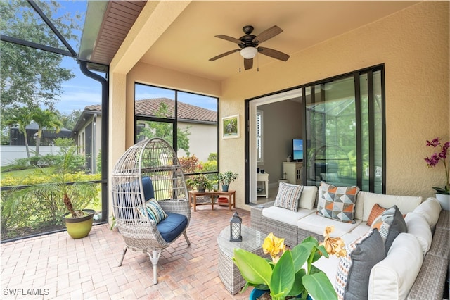 sunroom with ceiling fan