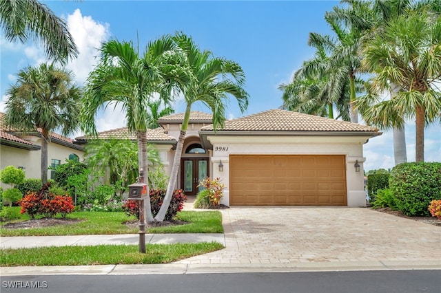 mediterranean / spanish-style home with a garage