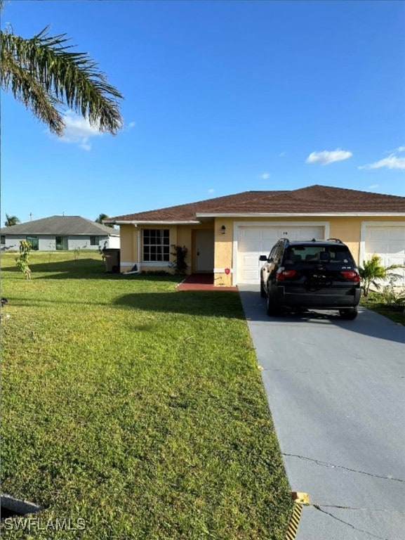 ranch-style home featuring a garage and a front lawn