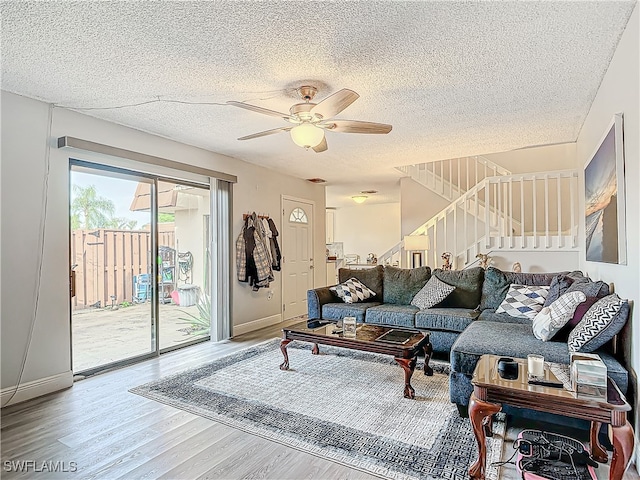 living room featuring hardwood / wood-style floors and a textured ceiling