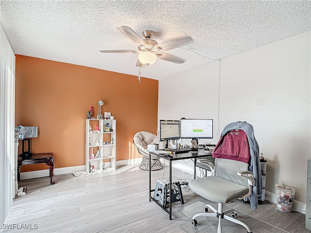 office space featuring light hardwood / wood-style floors and a textured ceiling