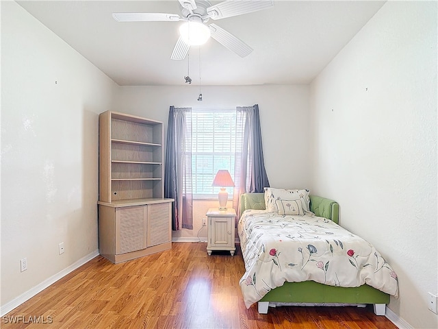 bedroom featuring light hardwood / wood-style flooring and ceiling fan