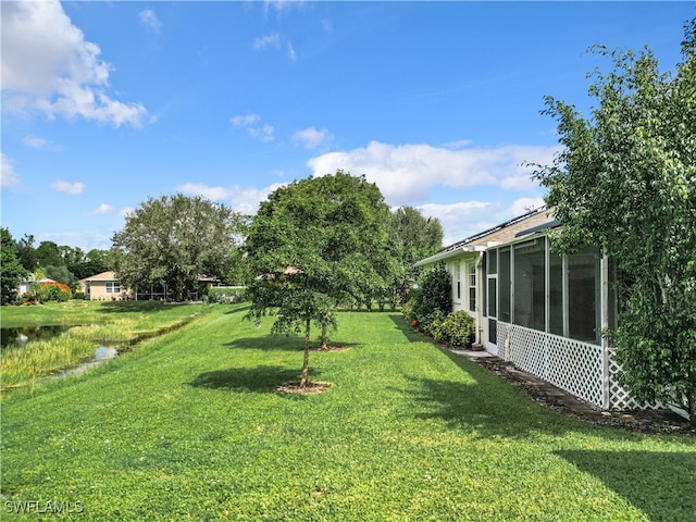 view of yard with a sunroom