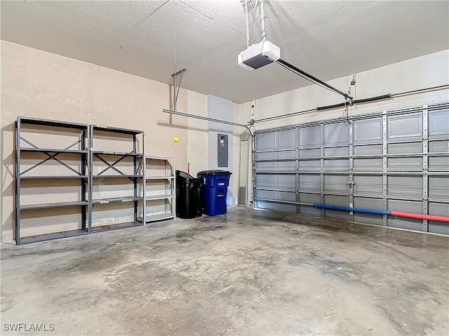 garage featuring electric panel and a garage door opener