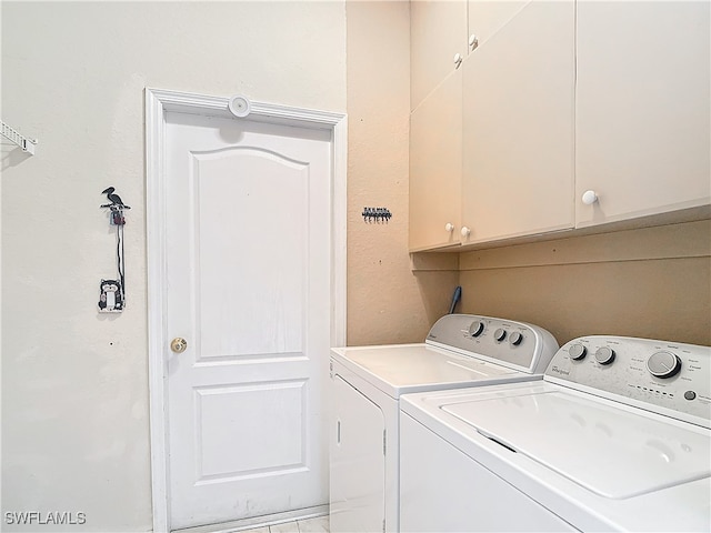 laundry area featuring cabinets and independent washer and dryer