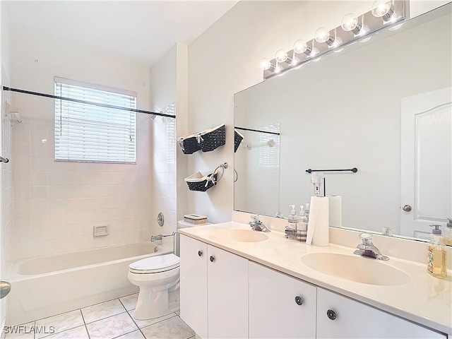 full bathroom featuring tile patterned flooring, vanity, toilet, and tiled shower / bath