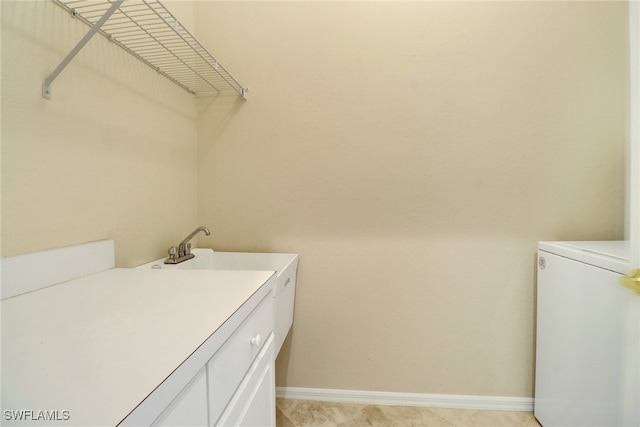 washroom with cabinets and separate washer and dryer