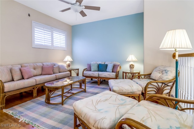 living room featuring hardwood / wood-style flooring and ceiling fan