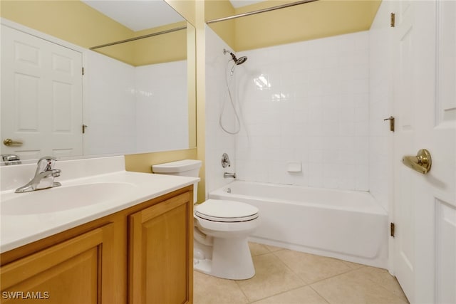 full bathroom with vanity, tiled shower / bath, tile patterned floors, and toilet