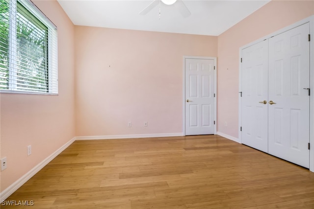 unfurnished bedroom with light hardwood / wood-style flooring and ceiling fan