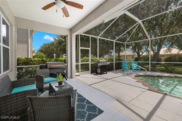 exterior space with glass enclosure, a patio, ceiling fan, an outdoor living space, and area for grilling