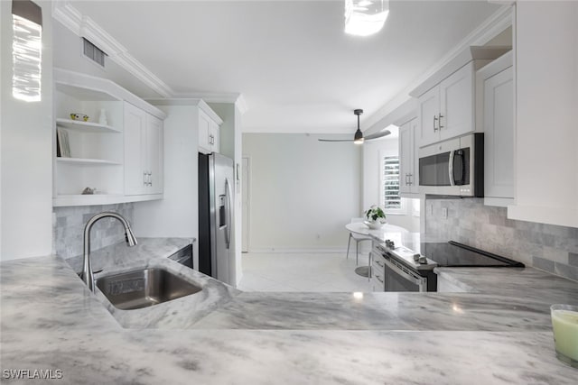 kitchen featuring open shelves, stainless steel appliances, visible vents, white cabinetry, and a sink