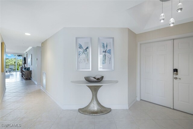 hall featuring light tile patterned flooring