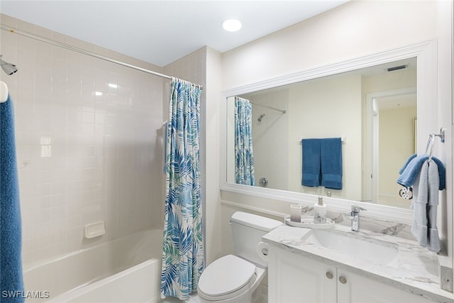 full bathroom with shower / bath combination with curtain, visible vents, vanity, and toilet