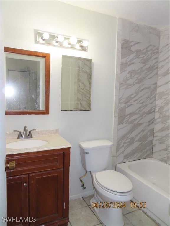 full bathroom featuring toilet, tiled shower / bath, vanity, and tile patterned floors