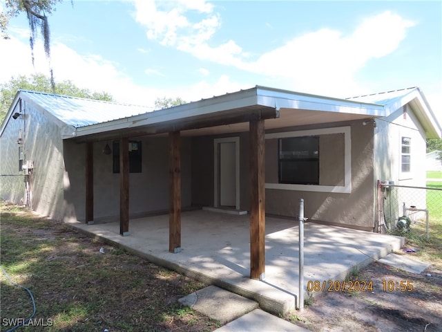 rear view of house with a patio