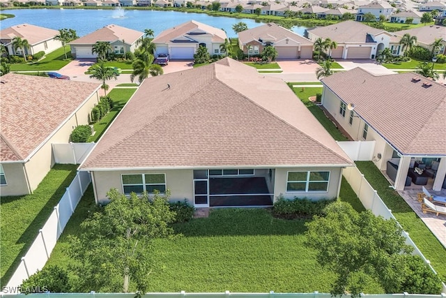 birds eye view of property featuring a water view and a residential view