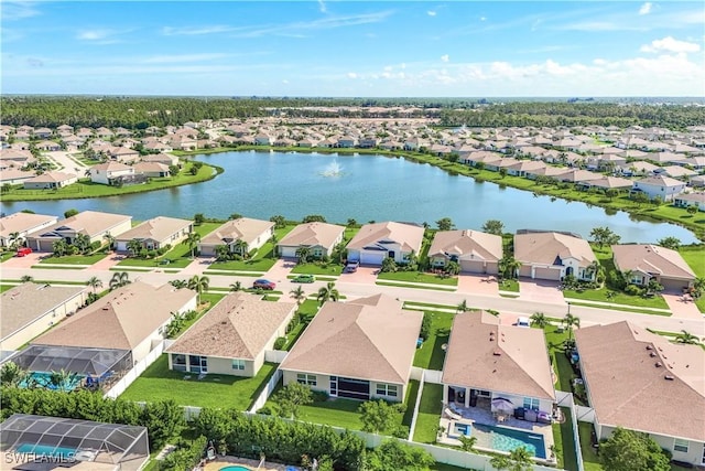 bird's eye view with a residential view and a water view