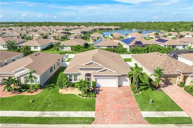 bird's eye view featuring a water view and a residential view