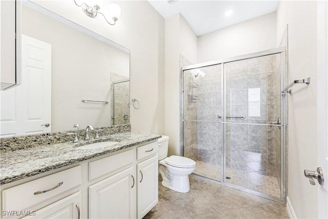 bathroom with a stall shower, tile patterned flooring, vanity, and toilet