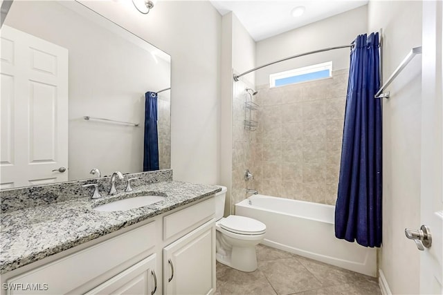 full bath featuring toilet, vanity, shower / bath combo with shower curtain, and tile patterned floors