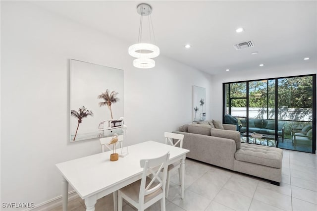 dining room with light tile patterned flooring