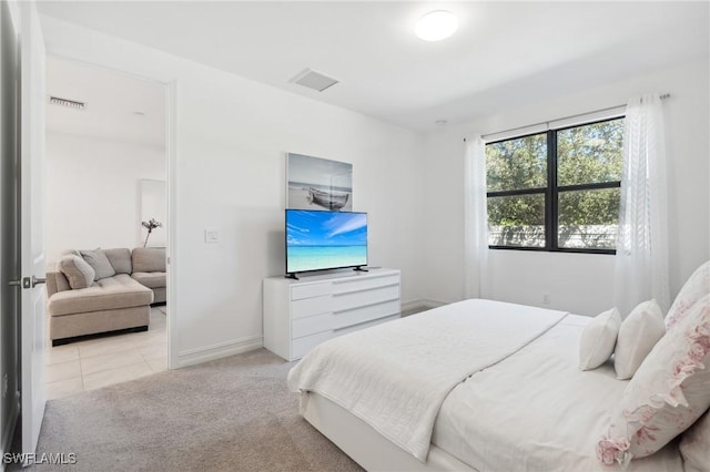 bedroom with light carpet