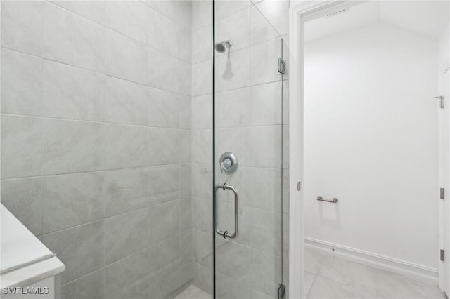 bathroom with a shower with shower door