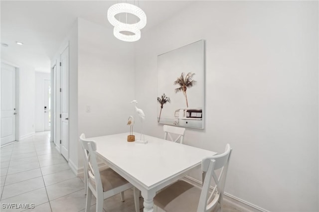 dining area with light tile patterned floors