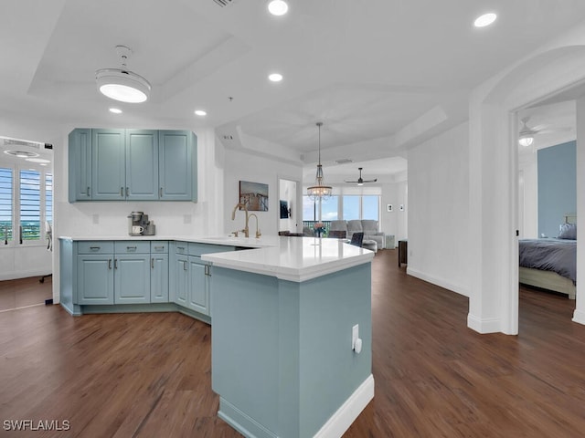 kitchen with ceiling fan, dark hardwood / wood-style floors, and a wealth of natural light