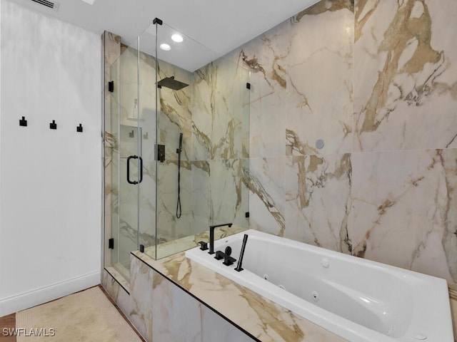 bathroom with plus walk in shower, tile walls, and tile patterned flooring