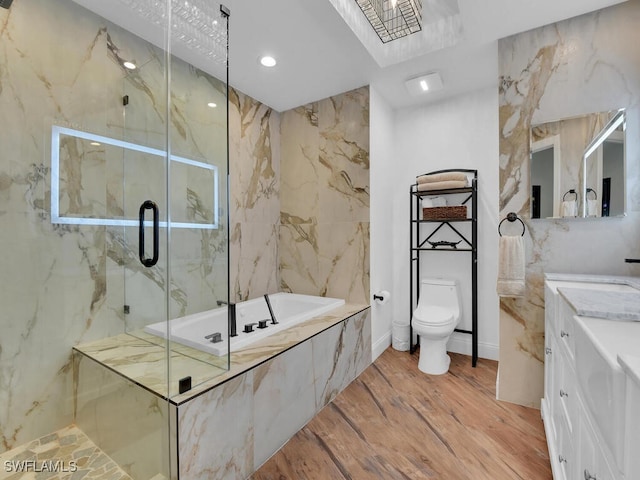 full bathroom with wood-type flooring, plus walk in shower, vanity, and toilet