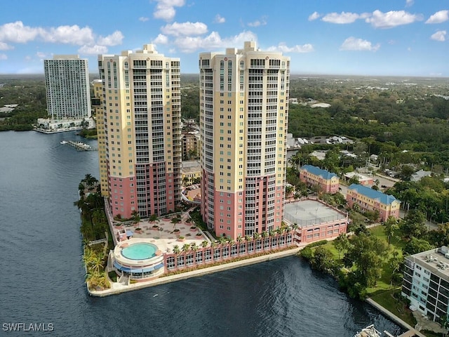 birds eye view of property with a water view