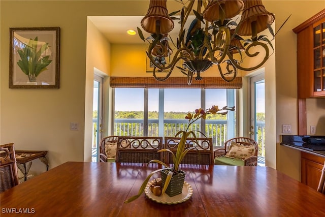 dining space featuring a chandelier