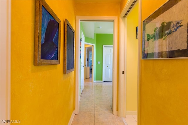 corridor with light tile patterned flooring