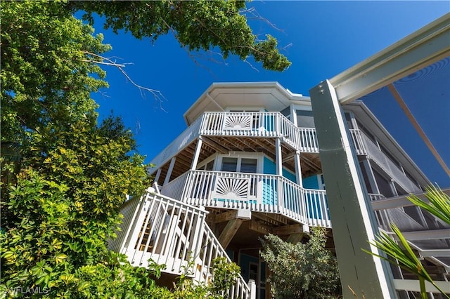 back of property featuring a balcony