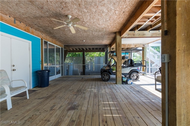 wooden deck featuring ceiling fan