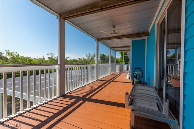 wooden terrace with ceiling fan