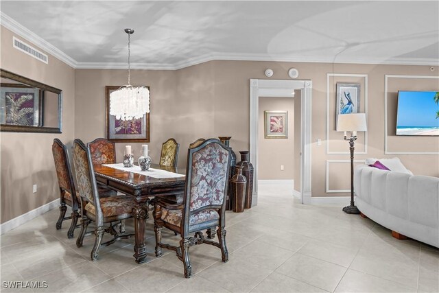 tiled dining space with an inviting chandelier and crown molding