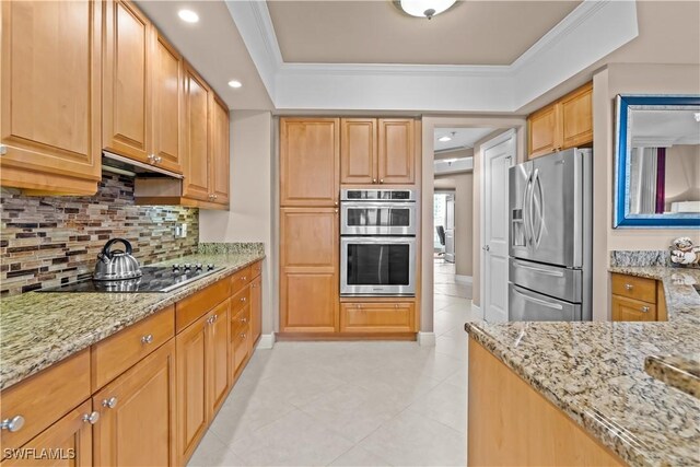 kitchen featuring crown molding, stainless steel appliances, and light stone counters