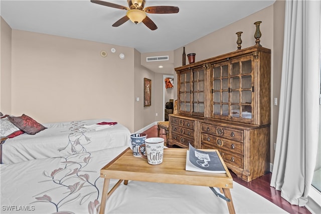 bedroom featuring hardwood / wood-style flooring and ceiling fan