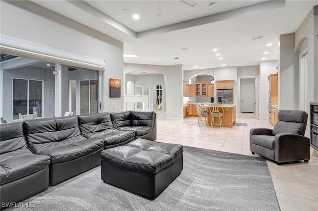 15120 Blackhawk Dr, Fort Myers, FL 33912 - living room with light tile patterned floors, arched walkways, and recessed lighting