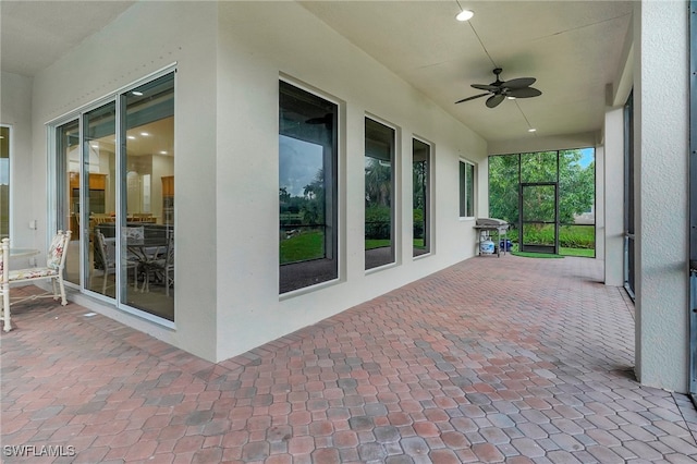 view of patio with a grill and ceiling fan