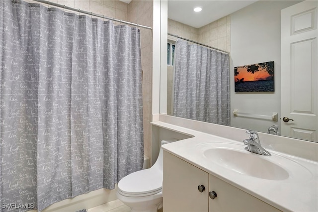 full bathroom featuring tile patterned flooring, vanity, toilet, and shower / tub combo