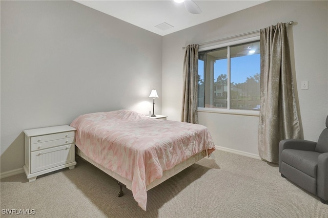 bedroom featuring ceiling fan and light colored carpet