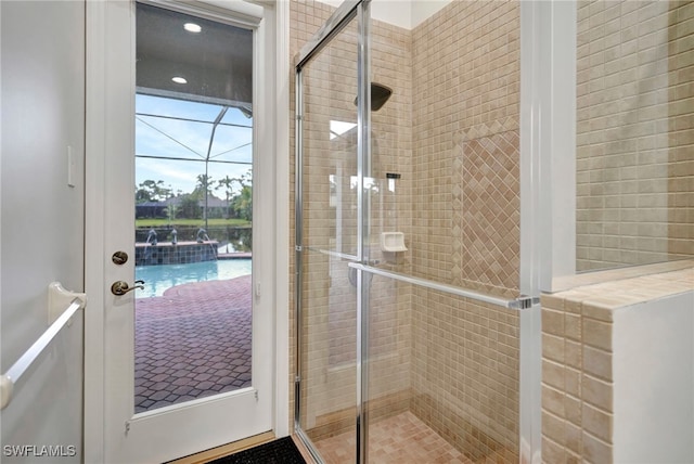 bathroom with a shower with shower door