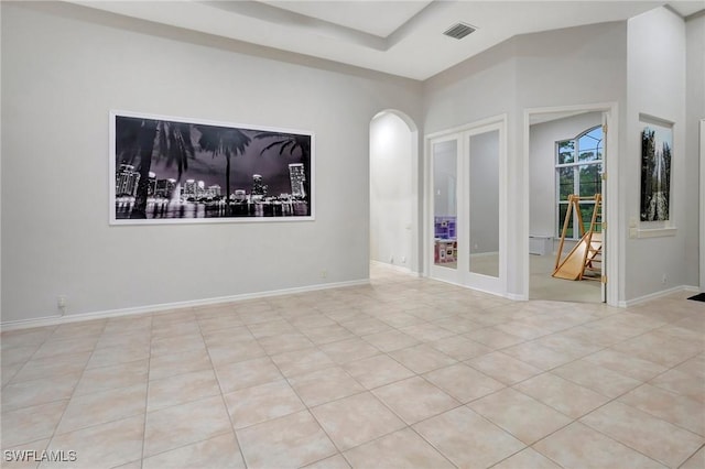 15120 Blackhawk Dr, Fort Myers, FL 33912 - spare room featuring arched walkways and tile patterned floors