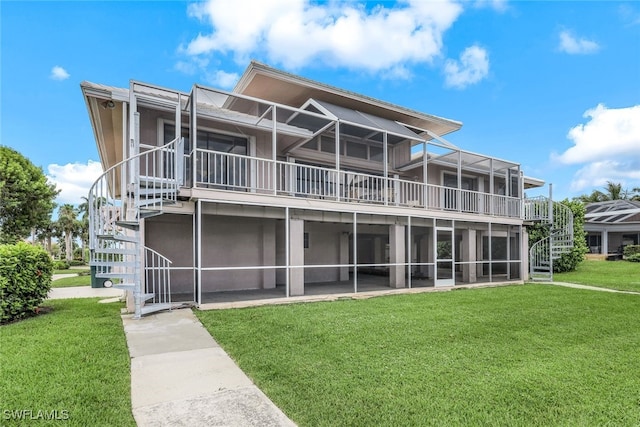 rear view of property with a yard